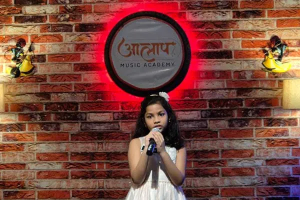 Young girl performs singing at Aalaap Music Center